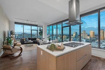 Modern wide-plank wood-style flooring throughout